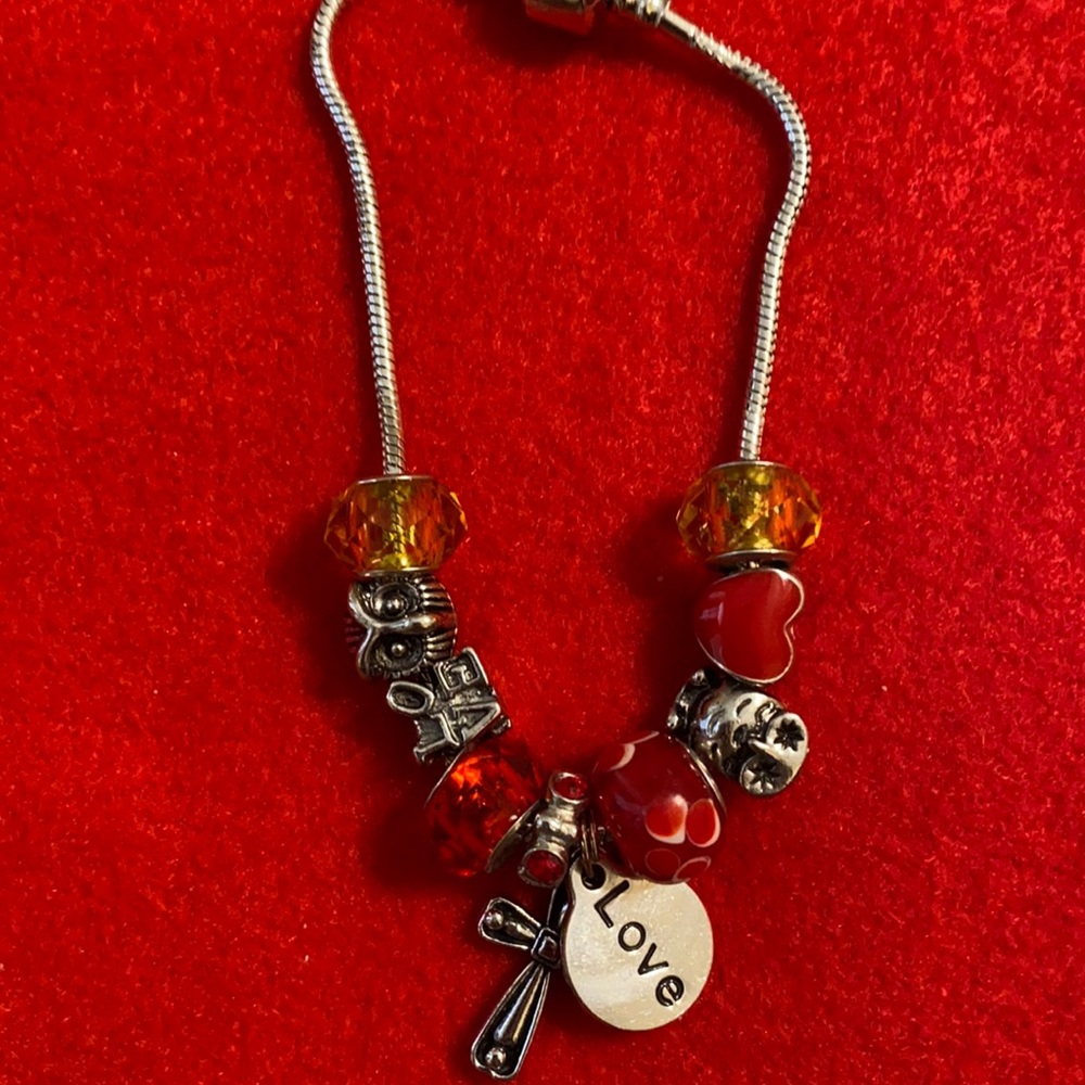 Red and white charm bracelet.